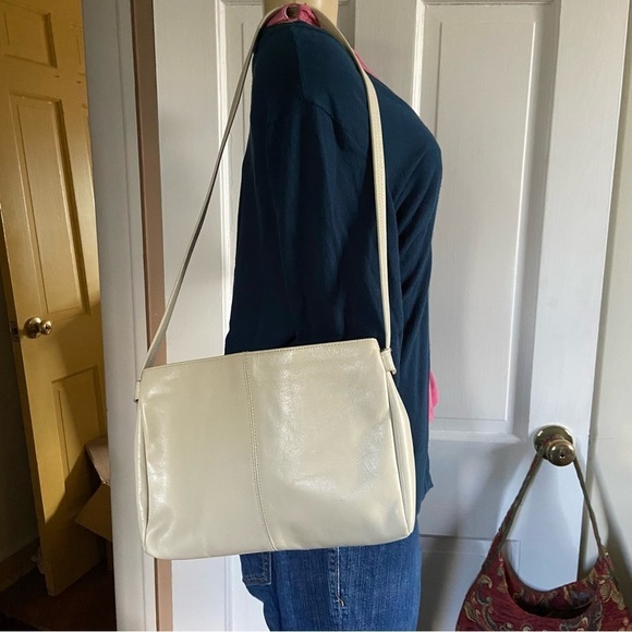 Leather shoulder handbag has 5 compartments that zip or snap for easy access. - Picture 3 of 8